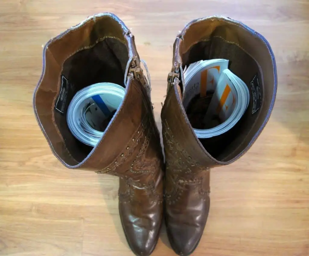 Try Inserting a Magazine or Newspaper inside the boots