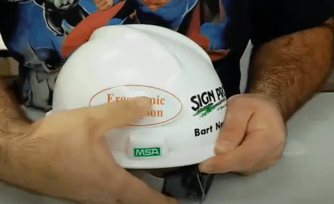 keep rubbing the sticker while placing it on the hard hat.